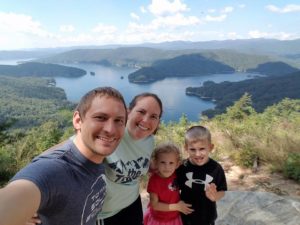 Smiling Family at Jumping Off Rock above Lake Jocassee.